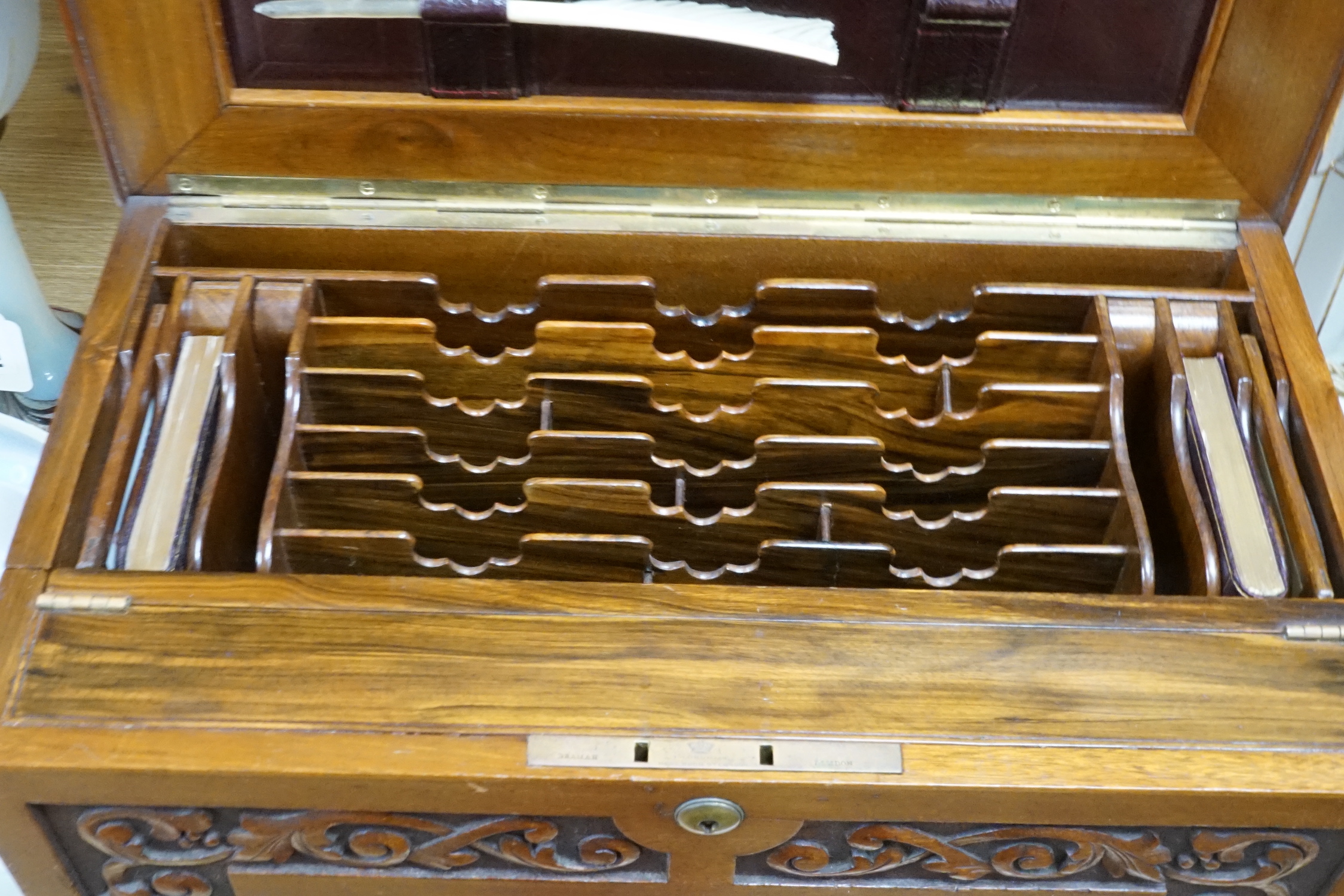 A Victorian carved walnut stationery case with Bramah lock, 42cm wide